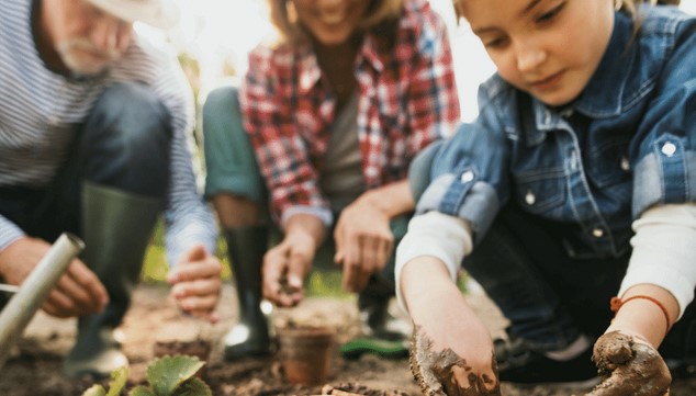 a family working in the garden